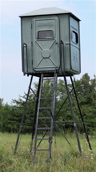 "Redneck" Fiberglass Hunting Blind on 10 Platform - Windows on all sides open, with Cupholder and Gun Rests - Door Side is 5 Across 66 Tall in Center of Interior - Foam Covered Walls and Door 