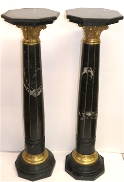 Pair of Outstanding Neoclassical Black Marble Corinthian Column Pedestals - Black Marble Top, Base, and Pedestal - Substantial Brass Corinthian Capitals - Pedestals Measure 46 Tall 13 Across