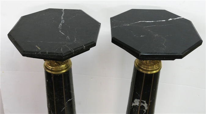 Pair of Outstanding Neoclassical Black Marble Corinthian Column Pedestals - Black Marble Top, Base, and Pedestal - Substantial Brass Corinthian Capitals - Pedestals Measure 46 Tall 13 Across