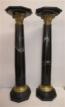Pair of Outstanding Neoclassical Black Marble Corinthian Column Pedestals - Black Marble Top, Base, and Pedestal - Substantial Brass Corinthian Capitals - Pedestals Measure 46 Tall 13 Across