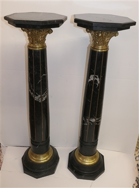 Pair of Outstanding Neoclassical Black Marble Corinthian Column Pedestals - Black Marble Top, Base, and Pedestal - Substantial Brass Corinthian Capitals - Pedestals Measure 46 Tall 13 Across