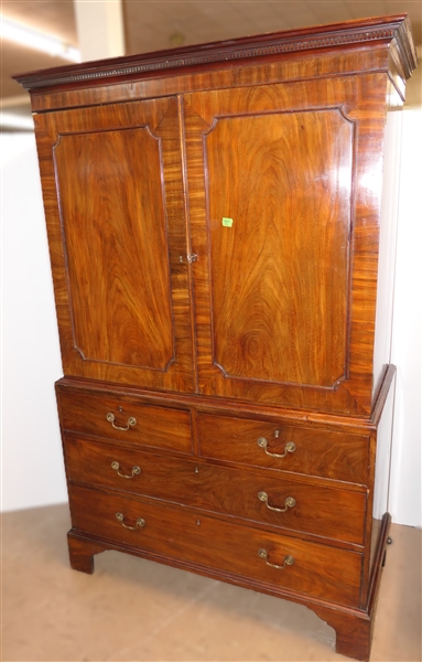 19th Century Mahogany Linen Press - Crotch Mahogany Doors - Crown Dentil Molding - Top Cabinet Has Been Converted To Wardrobe with Clothing Bar - Base with 4 Finely Dovetailed Drawers - Bracket...