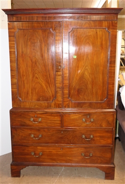 19th Century Mahogany Linen Press - Crotch Mahogany Doors - Crown Dentil Molding - Top Cabinet Has Been Converted To Wardrobe with Clothing Bar - Base with 4 Finely Dovetailed Drawers - Bracket...