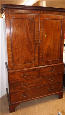 19th Century Mahogany Linen Press - Crotch Mahogany Doors - Crown Dentil Molding - Top Cabinet Has Been Converted To Wardrobe with Clothing Bar - Base with 4 Finely Dovetailed Drawers - Bracket...