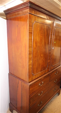19th Century Mahogany Linen Press - Crotch Mahogany Doors - Crown Dentil Molding - Top Cabinet Has Been Converted To Wardrobe with Clothing Bar - Base with 4 Finely Dovetailed Drawers - Bracket...