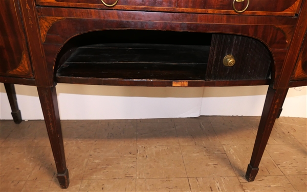 Very Fine English Regency Period Bow Front Sideboard - Outstanding Urn Inlay on Top Surface - Brass Gallery with Urn Finials Inlaid Drawer Fronts with Lions Head Pulls - Tambour Door Below Center...