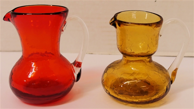 2 Hand Blown Art Glass Pitchers - Amber Crackle Glass with Clear Applied Handle and Red with Clear Applied Handle - Red Pitcher Measures 3 3/8 Tall 