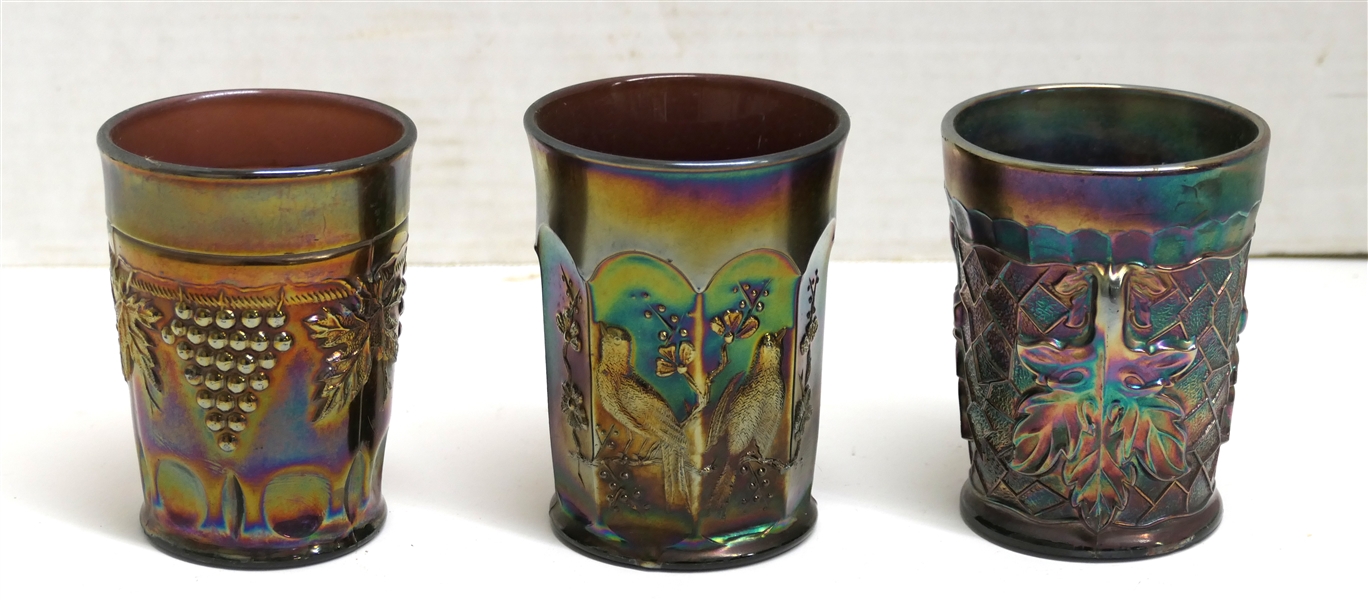 3 Amethyst Carnival Glass Tumblers - Maple Leaf, Northwood "Singing Birds" , and Grape and Cable - Tiny Nick Along Bottom Edge 