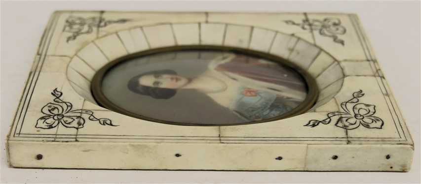 19th Century Hand Painted Portrait on Porcelain Beautiful Lady with Pearls and Red Cloak - Blue Dress with Pink Bows - Framed in Bone Overlaid Frame with Bow Details - Frame Measures 5 1/2 By 4...
