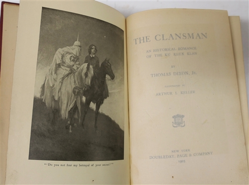 2 Copies of The Clansman by Thomas Dixon - Both 1905 Edition Hardcover Books - One Cover is Slightly Faded with Only Thomas Dixon other Darker Red with Thomas Dixon Jr. 