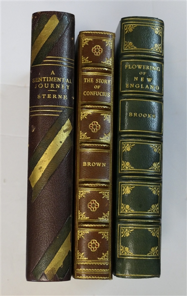 3 Leather Bound Books - "A Sentimental Journey" by Sterne 1937 - Horace Liverite, "The Story of Confucius" by Brown - 1927 David McKay Company, and "Flowering of New England" by Brooks - 1936 -...