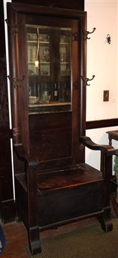 Oak Hall Tree with Beveled Mirror Back - Column Style Back with Nice Hooks - Bust Medallion Under Arm - Hinged Lift Top Seat - Rolled Arms - Measures 75 Tall 29 1/2 by 18 1/2  - Seat Has Split...