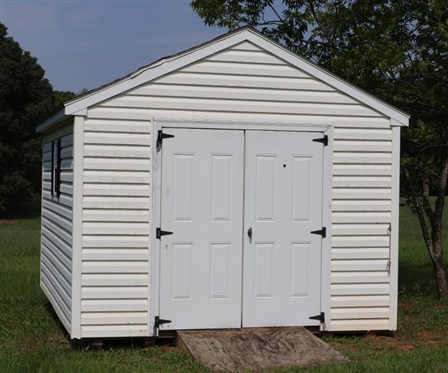 10ft by 12ft Storage Building - Double Doors, and 2 Windows -Window Unit in Top Vent - NOT WIRED - NO Contents - Buyer Must Have Moved 