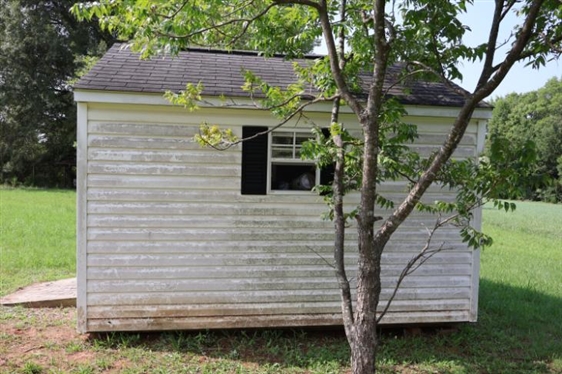 10ft by 12ft Storage Building - Double Doors, and 2 Windows -Window Unit in Top Vent - NOT WIRED - NO Contents - Buyer Must Have Moved 